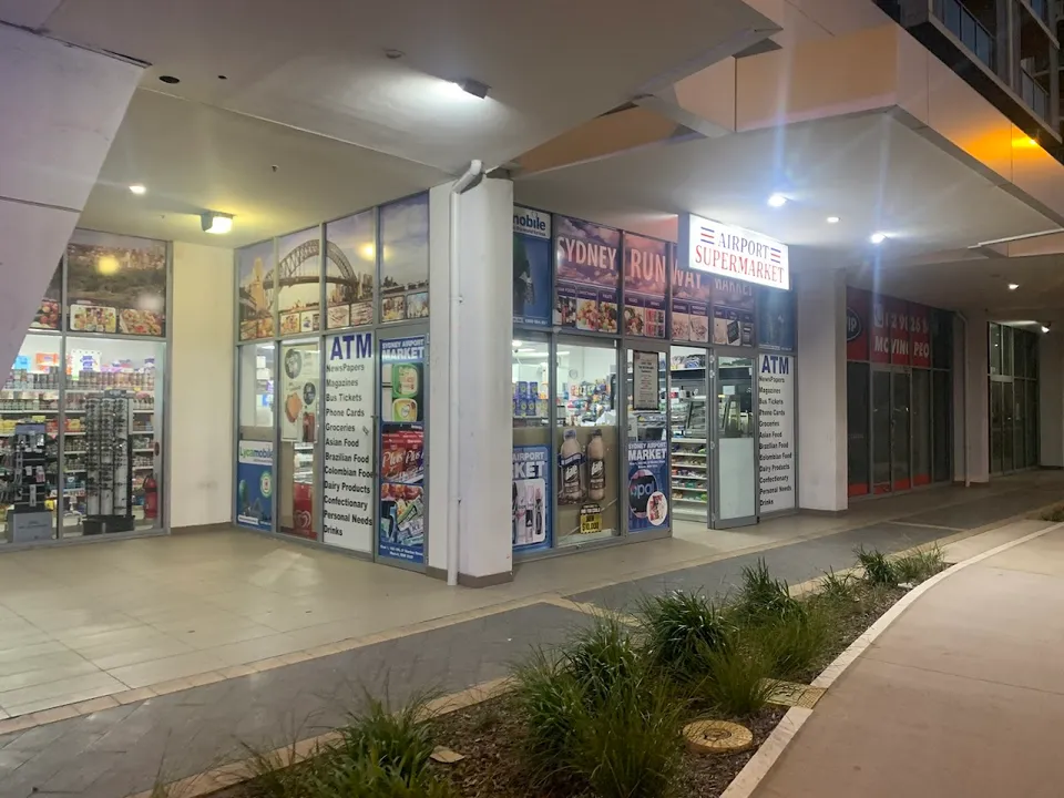 Airport Supermarket storefront at night